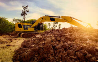 Bulldozer clearing land for a construction project. Increase property value by land clearing, concept image.